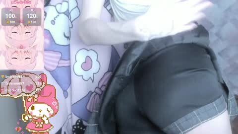 Media: A video captures a close-up of a person in a black vest, partially revealing their buttocks. The background features a pink, heart-themed anime character. The image also includes a digital chat screen displaying a profile picture of a pink-haired anime girl.