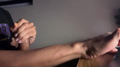 Media: Video of a close-up hand grip with two hands holding a wooden handle, one with a tattooed arm and the other with a smooth, lighter skin tone.