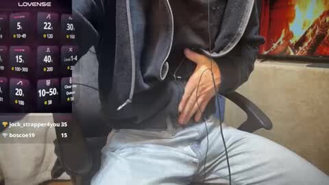 Media: A video shows a person wearing a black hoodie and light blue jeans, seated with hands in lap, headphones on, and a screen displaying a weather forecast.