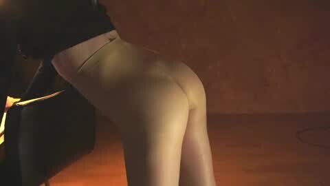 Media: A dimly-lit video captures a person with pale skin and a curvaceous, hourglass figure, wearing black leggings and a black top, bending over, highlighting their buttocks and lower back. The background is a textured, reddish-brown wall.